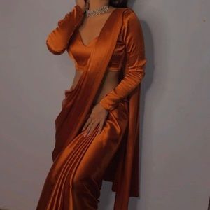 Pre-stitched copper/rust orange sarees . Brand new -blouse not included.